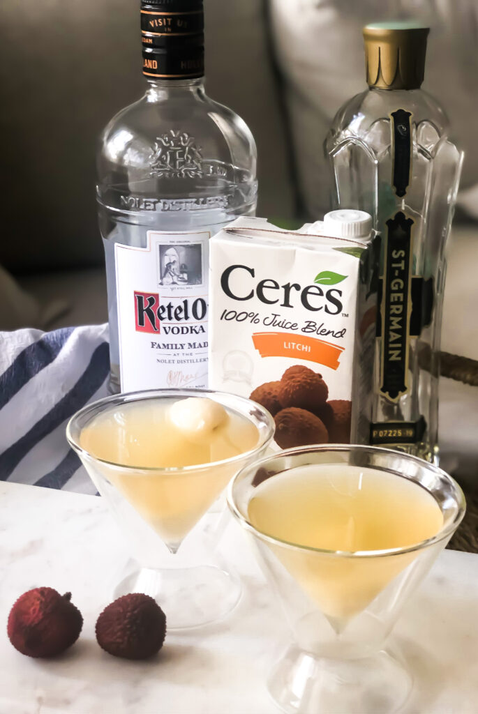 Simple Lychee Martini Recipe with just 3 ingredients topped with a fresh lychee. These delicious lychee martinis are the perfect summer cocktail featuring St. Germain and Lychee. | KirstenTurk.com
