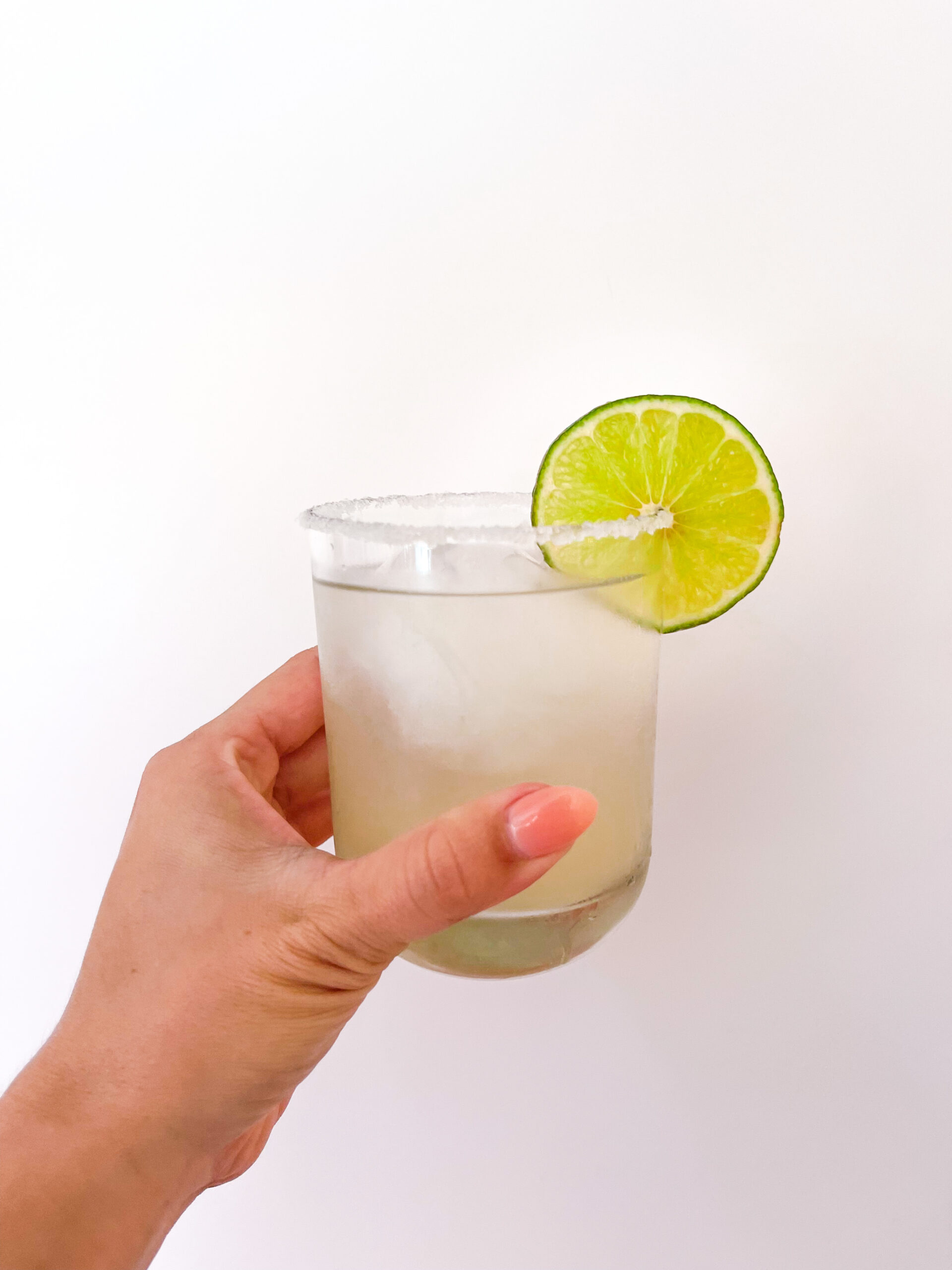 Sometimes you just feel like enjoying a classic lime margarita. This simple margarita recipe is worth memorizing. That way, you can whip it out at a moments notice and impress your friends or even just yourself! It's so simple and satisfying, and it's made with just 4 ingredients that are easy to always have on hand. | kirstenturk.com