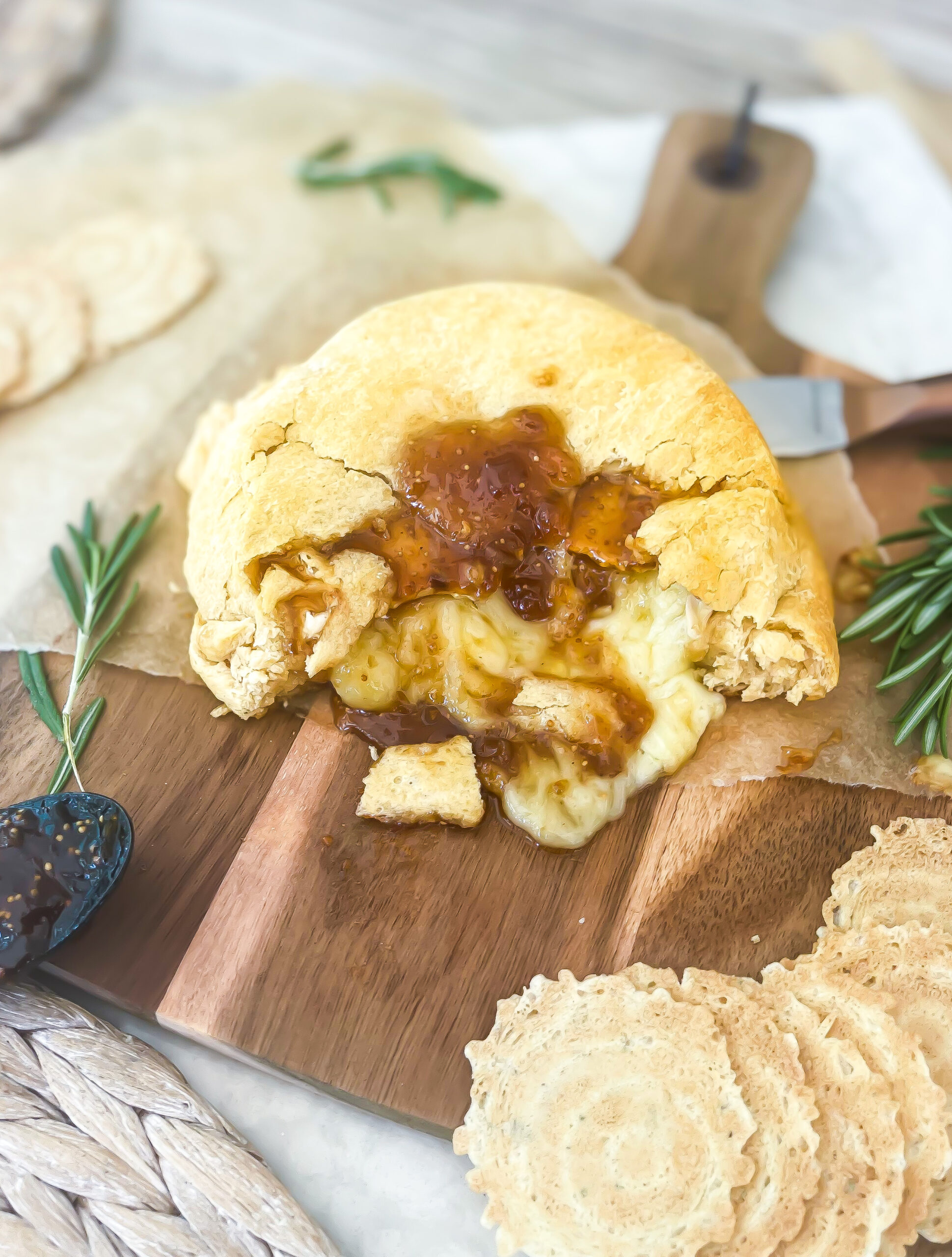 This Easy Fig Jam Baked Brie Recipe is just 3 ingredients and comes together in less than 20 minutes making it a quick and easy appetizer. This is a Crescent Roll Dough Sheet Recipe using crescent rolls, brie cheese and fig jam | kirstenturk.com