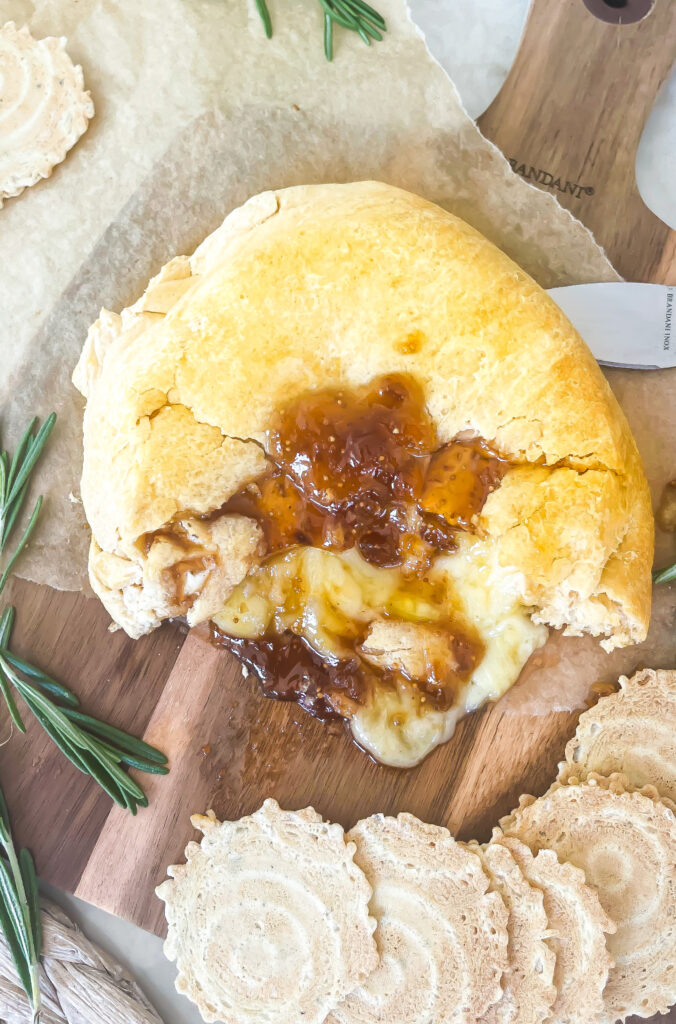 This Easy Fig Jam Baked Brie Recipe is just 3 ingredients and comes together in less than 20 minutes making it a quick and easy appetizer. This is a Crescent Roll Dough Sheet Recipe using crescent rolls, brie cheese and fig jam | kirstenturk.com