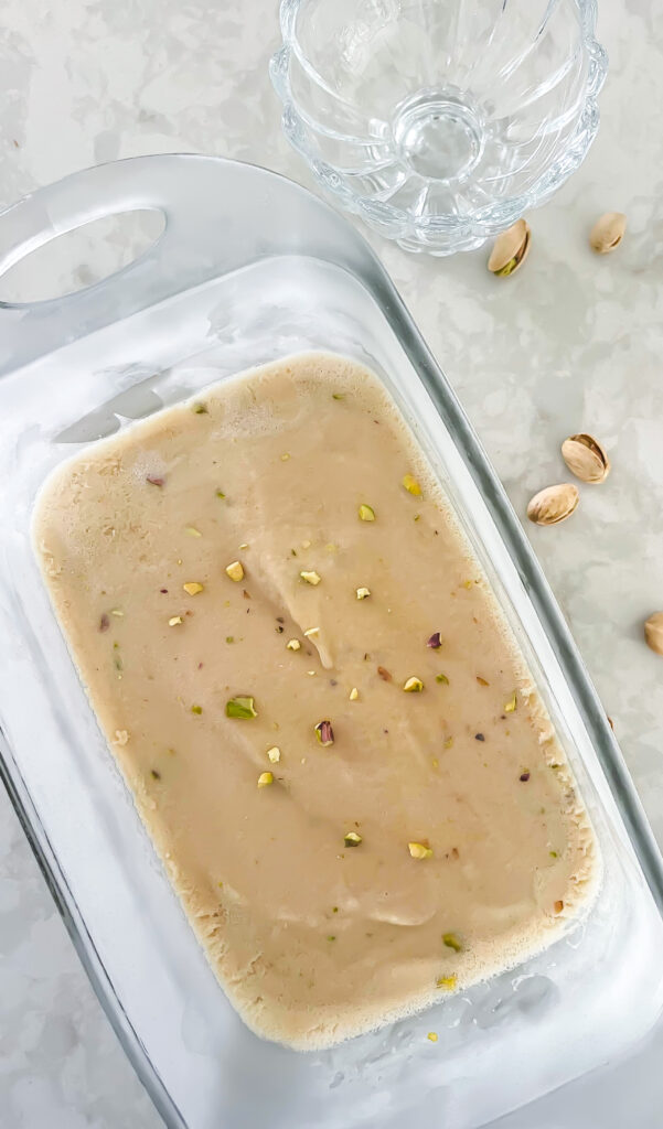 This Dairy-Free Pistachio Ice Cream Recipe comes together in just four ingredients and is eggless making it vegan ice cream! Find the simple recipe at kirstenturk.com