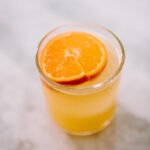 This simple and refreshing orange ginger margarita combines fresh squeezed orange juice, ginger simple syrup and tequila to make your new favorite margarita! Get the recipe on the blog kirstenturk.com