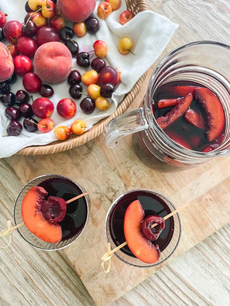 We're in peak stone fruit season, my favorite time of year. I've been putting it in as many recipes as I can like this Stone Fruit Sangria! This stone fruit sangria is so good! It's full of delicious fruit that soaks up some of the yummy sangria, so once the sangria is gone, you still have sangria infused stone fruit to snack on... um, yes please! It combines red wine, bourbon, cherry juice and lots of stone fruit for the perfect summertime sangria. Get the full recipe on the blog at kirstenturk.com