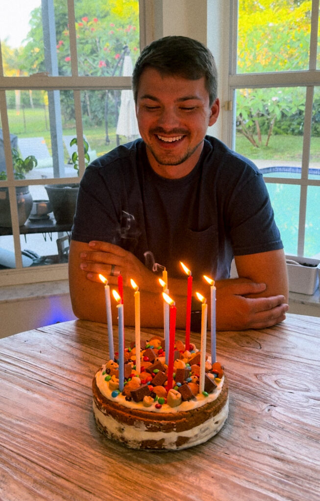 This Chocolate Chip Cookie Dough Ice Cream Cake is so good! Think of a giant ice cream cookie sandwich, soft and chewy cookie with cookie dough ice cream in-between. Topped with candy and more cookie dough. It's the perfect birthday cake for cookie dough lovers! Get the details on kirstenturk.com