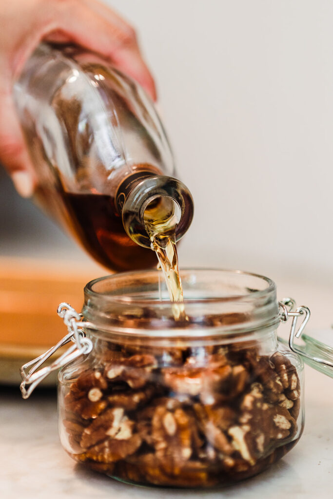 Cozy up this fall with homemade Toasted Pecan Infused Bourbon! 🍂🥃 This easy-to-make infused bourbon is perfect for fall cocktails like Old Fashioneds and spiced cider. Rich, nutty, and full of warm autumn flavor, it’s a must-have for seasonal drinks and desserts. Save this recipe for unique fall cocktail ideas and elevate your autumn gatherings with a delicious twist! Get the full recipe on the blog at kirstenturk.com  #FallCocktailRecipe #InfusedBourbon #ToastedPecan #FallDrinks