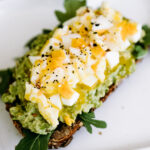 This simple, yet delicious avocado toast recipe is the best because it's easily customizable. Get all the details on the blog at kirstenturk.com | It's the perfect healthy breakfast idea to start the day!